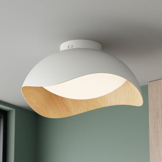 Adara 15 in. (38 cm) Modern LED Flush Mount Ceiling Light 5 CCT, a white dome-shaped light with a curved wooden interior rim.