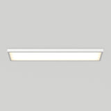 A rectangular, white ceiling light fixture is illuminated against a plain, light gray background. The design is modern and minimalistic.