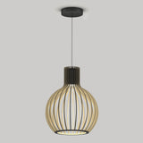 A modern pendant light with a black ceiling mount and a round, cage-like shade made of vertical wooden slats, hanging against a plain light gray background.