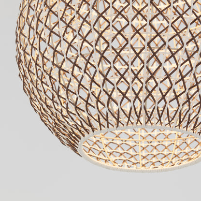A close-up of the Artika Benson LED pendant light 5 CCT shows its intricate woven lattice design in thin brown strips, glowing warmly against a plain light gray background.