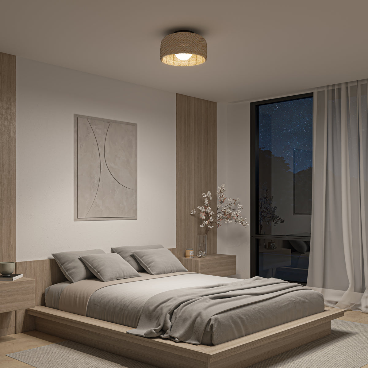 Minimalist bedroom featuring a low wooden bed, gray bedding, two nightstands, an Artika Emiko modern LED flush mount light 5 CCT, abstract wall art, a vase with flowers, and a large window with sheer curtains revealing a starry night sky.