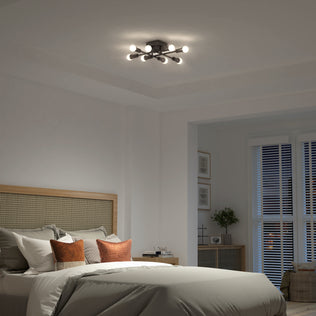 Modern bedroom with a neatly made bed and Artika's Aristo LED flush mount 3 CCT ceiling light for perfect ambiance.