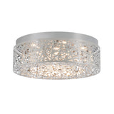 A modern, round flush mount ceiling light with a silver metal frame featuring an intricate, geometric cutout pattern and sparkling crystal accents inside.