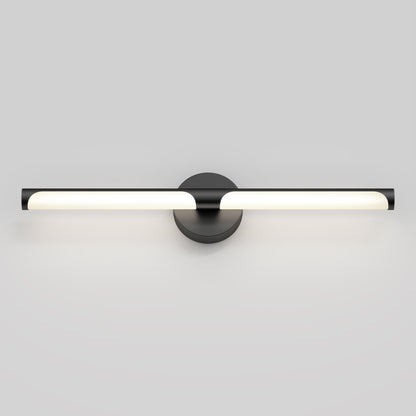 The Artika Ilona LED bathroom vanity light 5 CCT features a modern horizontal cylindrical bar in glowing white, mounted on a round black base and set against a plain light gray wall.