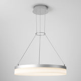 A modern round pendant ceiling light with a sleek silver frame, suspended by three thin cables, emits a soft white glow against a plain light gray background.