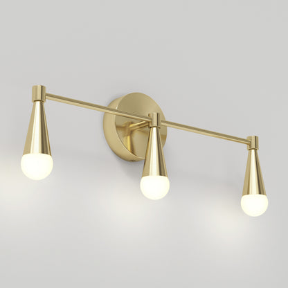 The Artika Wayden LED mid-century bathroom vanity light features three brass cone sockets with round white bulbs, arranged horizontally. This modern wall-mounted fixture offers 3 selectable color temperatures.
