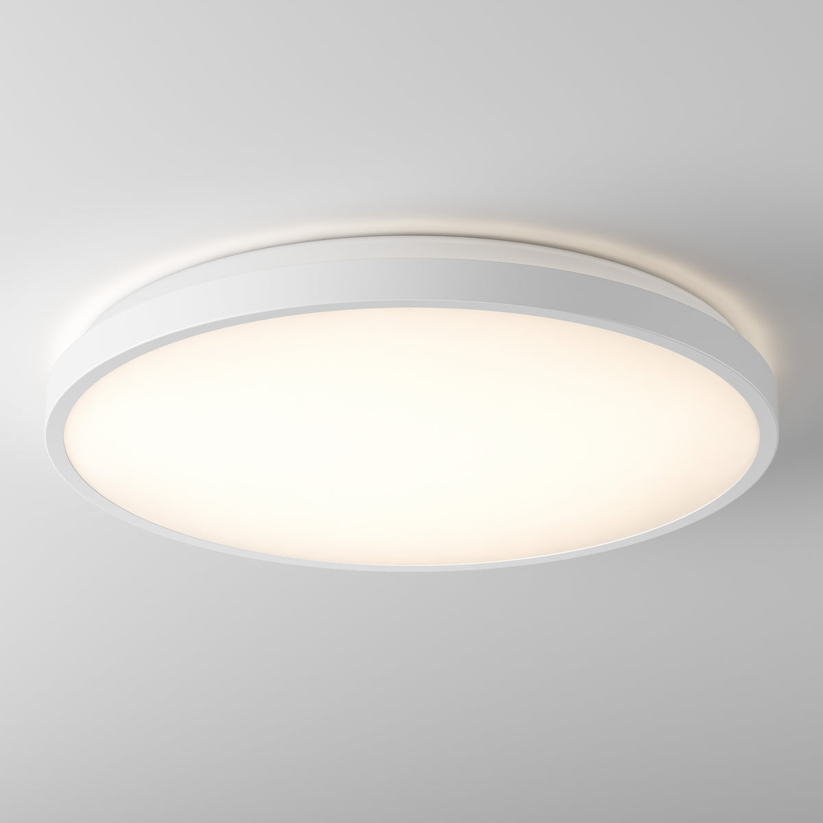 The Isara 15 in. RGBIC LED Flush Mount by Artika glows softly on the ceiling, its white trim blending seamlessly with the decor.