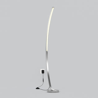 The Artika Arc LED Floor Lamp features a modern arched design, slim metallic base, integrated dimmable LED light strip, and plugs into a wall outlet. Shown against a plain light gray background.