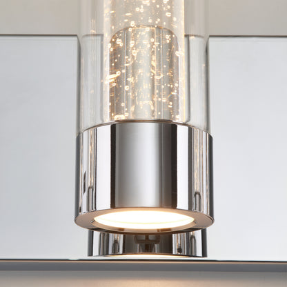 Close-up of Artika Essence 27-in modern LED vanity light with chrome base and bubble glass, illuminated from below.