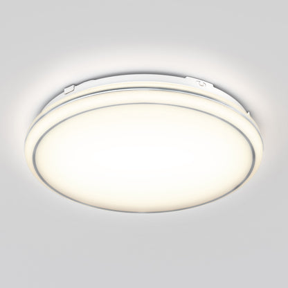 The Artika Emina 13 in. LED flush mount light offers a round, modern design and emits a soft, bright white glow on a light gray ceiling, with 3 selectable color temperatures.