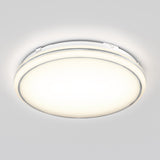 A round, flush-mounted ceiling light fixture emitting a bright, even glow against a plain white ceiling.