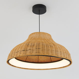 The Artika Raina LED pendant light 5 CCT features a wide, curved woven rattan shade suspended from a black cord and round black ceiling mount, creating a stylish contrast against a plain white ceiling.
