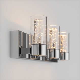 The Artika Essence 3 LED vanity light features three glass cylinders with warm integrated LEDs on a sleek chrome base.