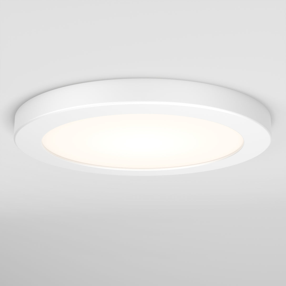 A round, white ceiling light fixture with a modern, minimalistic design is illuminated against a plain white ceiling.