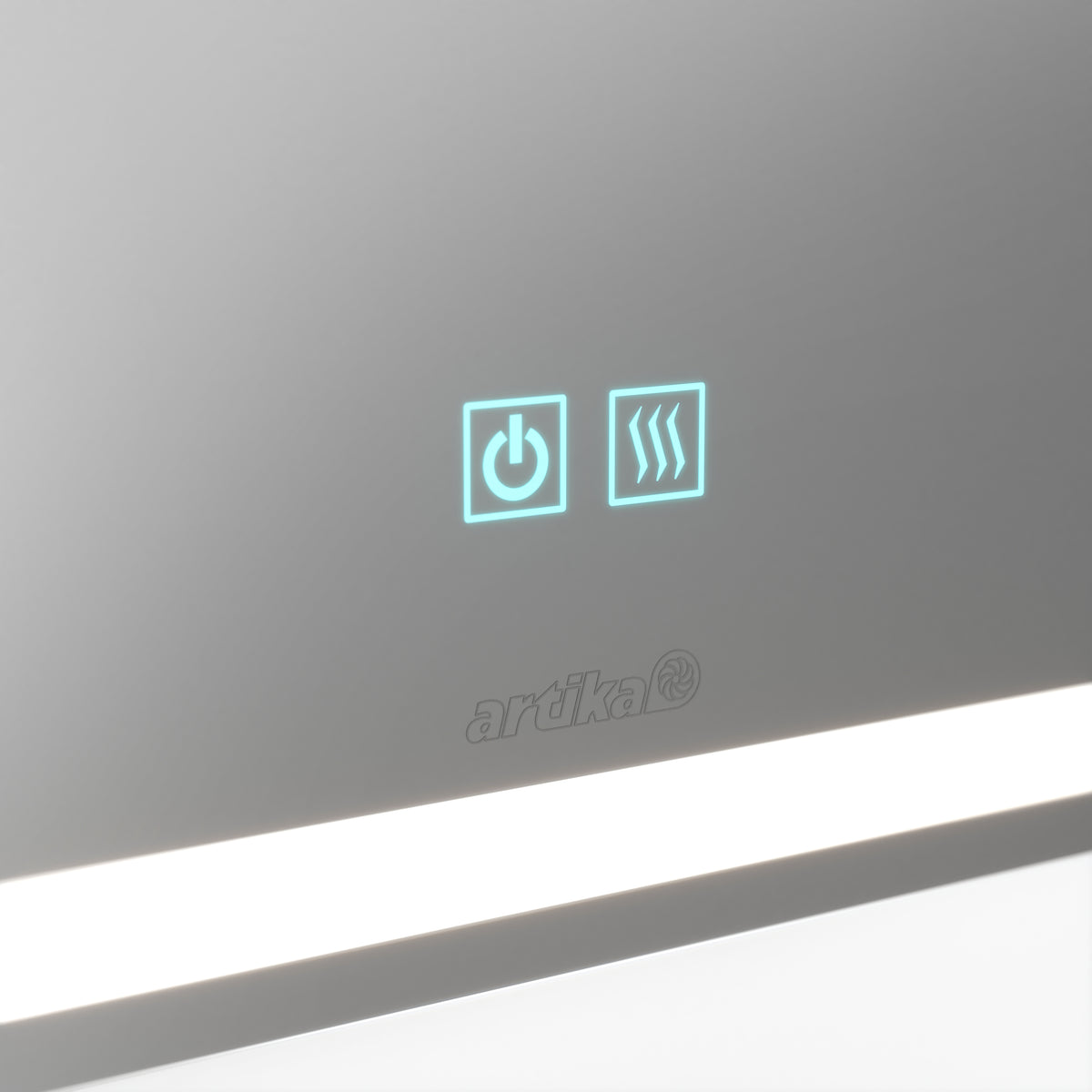A close-up of a mirror featuring two illuminated touch icons: a power symbol and a heated mirror symbol. The brand name artika is visible below, and a horizontal LED light runs along the bottom edge.