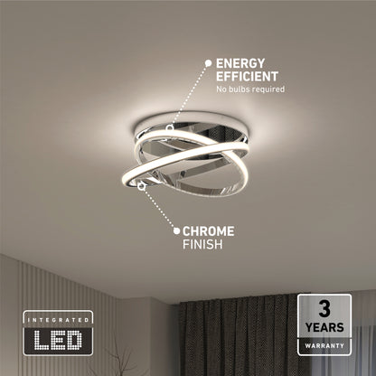 The Artika Orbia modern LED flush mount light 3 CCT features a chrome finish, is energy efficient, needs no bulbs, and includes a 3-year warranty. Shown mounted on a white ceiling with dark curtains visible in the room.