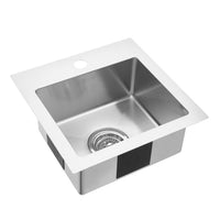 The Artika Plaza 15 in. single bowl stainless steel bar sink features a pre-drilled faucet hole, drain hole, and strainer—ideal for modern kitchens.
