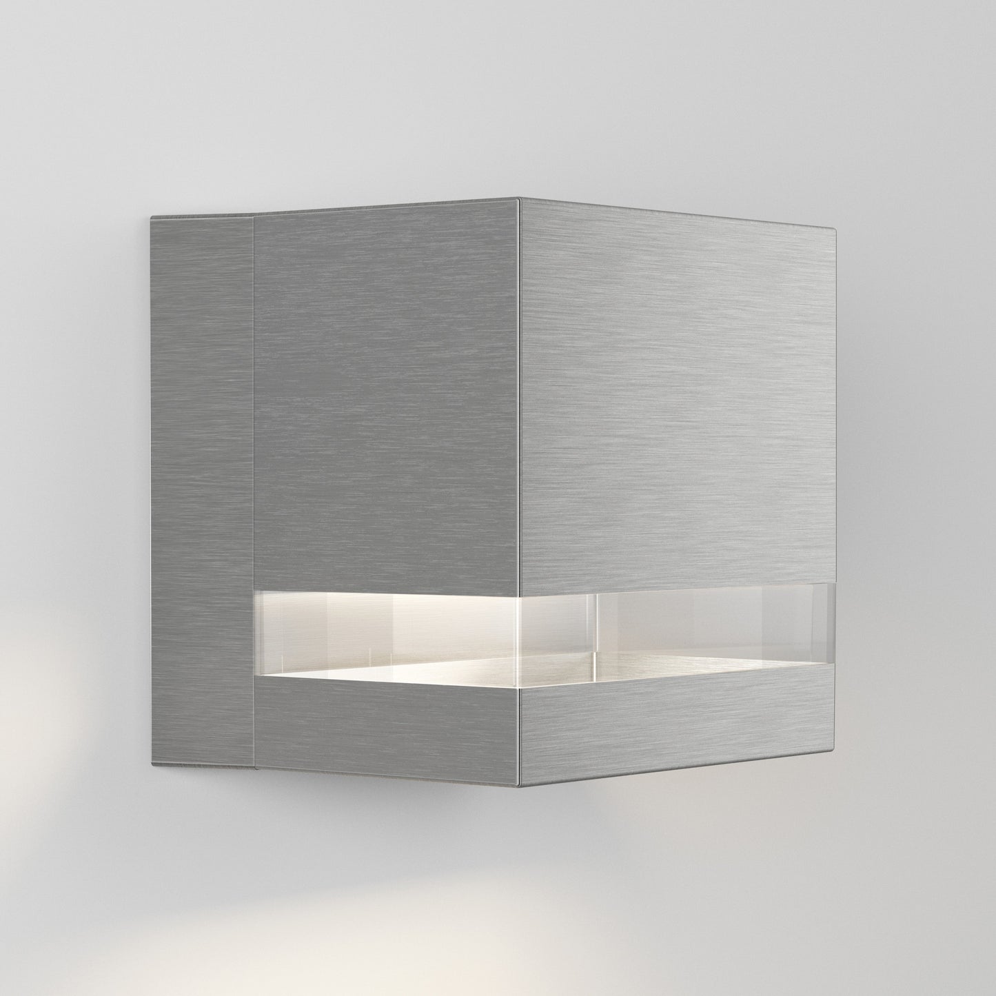 The Valor Square LED indoor/outdoor wall light by Artika-CAN-dev features a modern cube design with a brushed metal finish and horizontal frosted band emitting soft white light, shown mounted on a plain white wall.