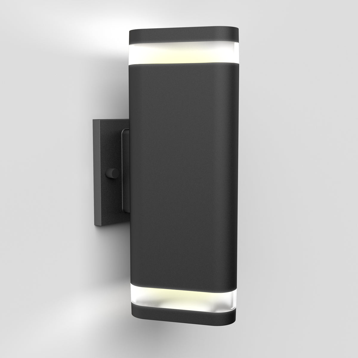 A modern, rectangular black wall-mounted light fixture with frosted panels on the top and bottom, emitting white light against a plain white background.