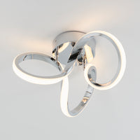 The Artika Swirl LED flush mount delivers 1300 lumens—perfect for brightening modern interiors with its chrome loop design.