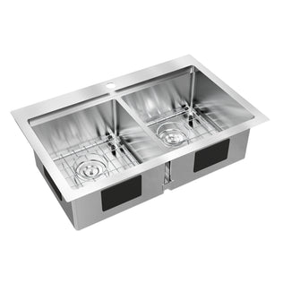 The Artika Newport double bowl stainless steel sink features a single faucet hole and includes metal grid racks for each basin.