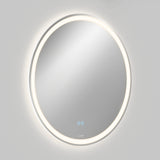 A round wall-mounted mirror with a built-in LED light ring around the edge, glowing softly. There are two blue touch control buttons visible on the mirrors surface. The background is plain and light-colored.