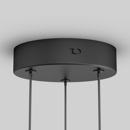 A close-up of the Orly modern LED pendant light 5 CCT by Artika-CAN-dev shows its round black ceiling mount with three hanging cables, set against a plain light gray background.