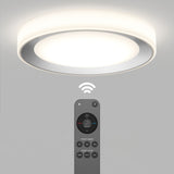 A modern round ceiling light glows softly above, with a wireless signal icon between the light and a remote control featuring various buttons for dimming and color temperature adjustment.
