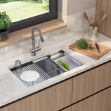 A modern kitchen sink with a marble countertop, a faucet, a dish rack holding a white plate and glass, utensils in a holder, a cutting board with chopped herbs, and a potted plant by a window.