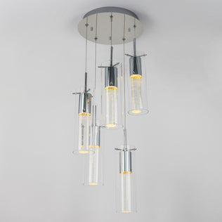 The Artika Essence 5-light LED pendant features five cylindrical glass shades suspended at varying heights from a round metallic base, each illuminated with an energy-efficient LED.