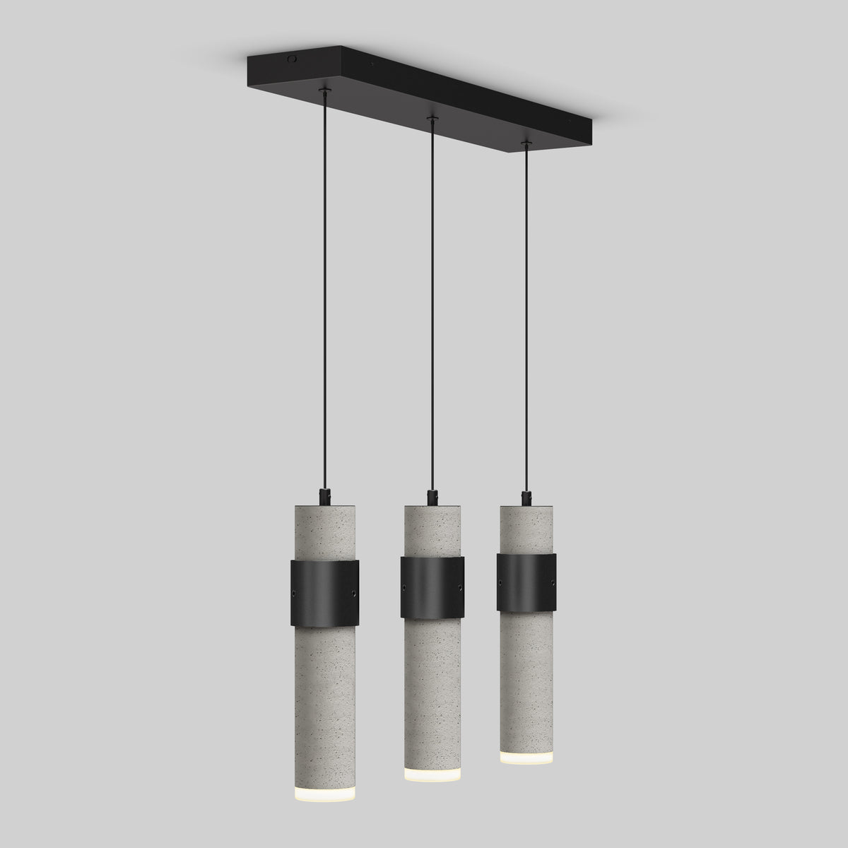 Three cylindrical pendant lights with concrete-grey finishes and black metal bands hang in a row from a rectangular black ceiling mount against a plain light grey background.