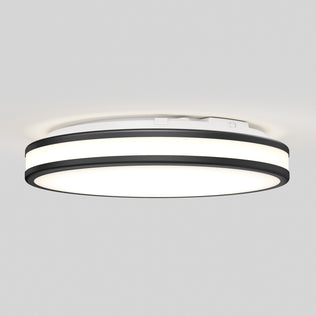 The Artika Hemisphere 15 in. LED flush mount light features a modern circular design with a white center and two black accent rings. Mounted on a light gray ceiling, its adjustable brightness delivers an even glow—perfect for bathroom lighting.
