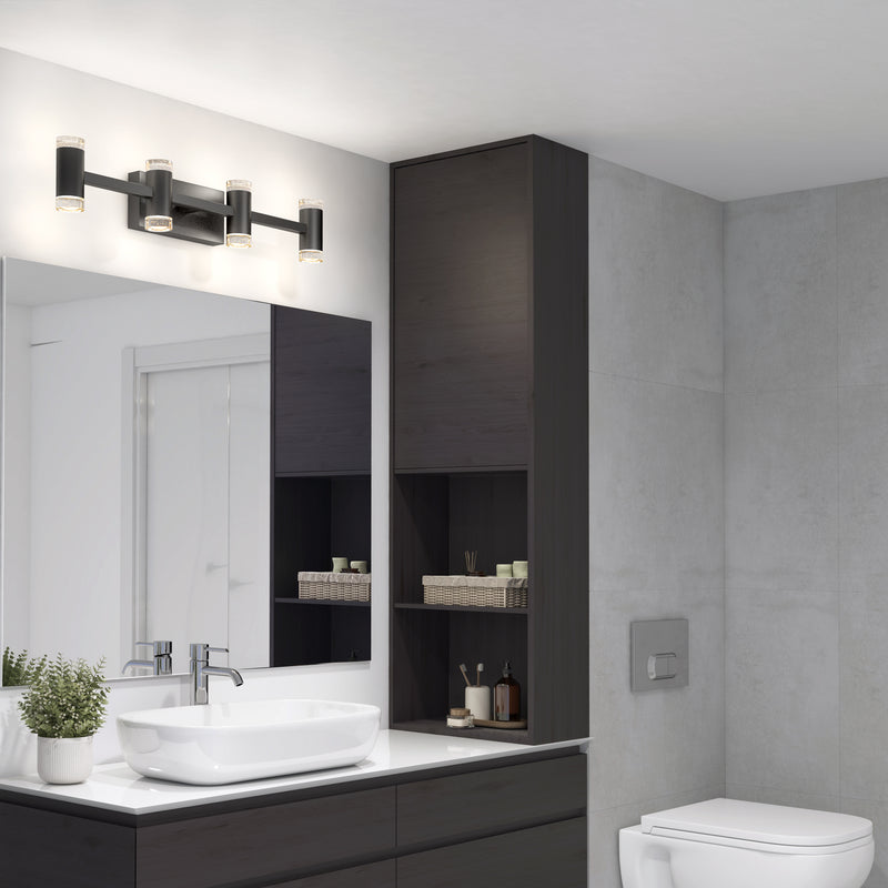 Modern bathroom with light gray walls, a rectangular mirror above a dark wood vanity and white vessel sink, potted plant, shelves with toiletries, wall-mounted toilet, and the Artika Mist 26-in Integrated LED 5-CCT Vanity Light Bar for perfect ambiance.