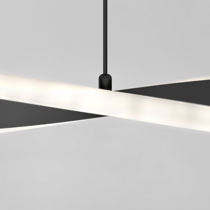 The Artika Finley Linear LED pendant light 3 CCT features two intersecting, sleek black-and-white bars suspended by a black cord against a light gray backdrop, creating a modern, minimalist geometric design.