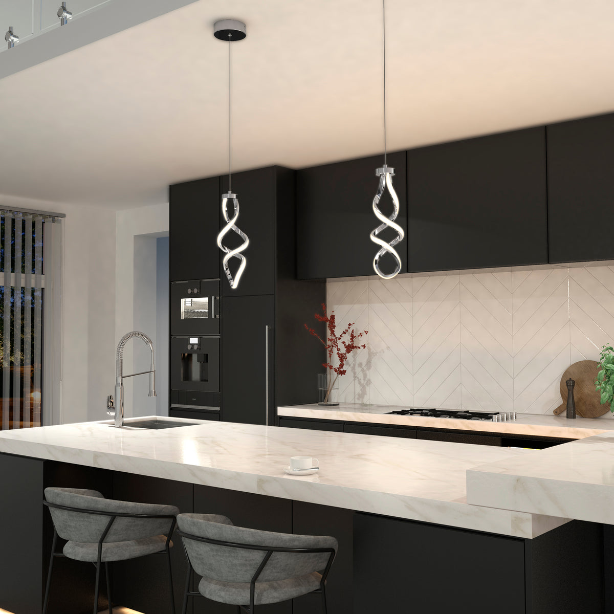 Modern kitchen with black cabinets, white marble countertops, two gray barstools, and two spiral pendant lights hanging over the island. Built-in appliances and a vase with branches are visible on the counter.