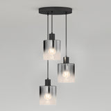 Modern ceiling light fixture with three hanging bulbs, each encased in a cylindrical, transparent glass shade. The cords are suspended from a round, black ceiling mount against a plain white background.
