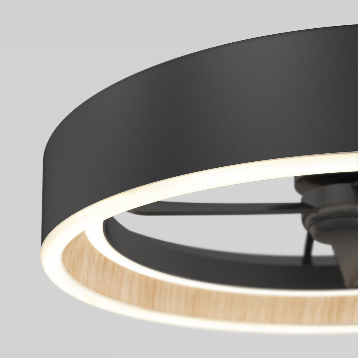 Close-up of the Artika Alton 24 in. LED modern ceiling fan featuring a circular black frame, illuminated LED ring, wooden inner accent, and 3 speeds with remote, set against a plain light gray background.