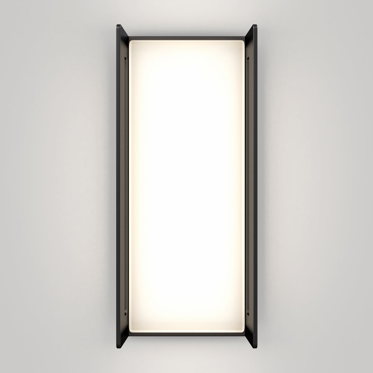A rectangular wall-mounted light fixture with black side panels and a bright, evenly illuminated white center, set against a plain light gray background.