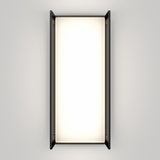 A rectangular wall-mounted light fixture with black side panels and a bright, evenly illuminated white center, set against a plain light gray background.