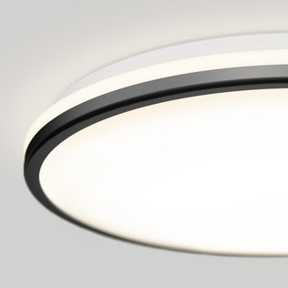 Close-up of Artika Macy 15 in. LED modern flush mount light, Alexa compatible, with black trim and glowing white surface.