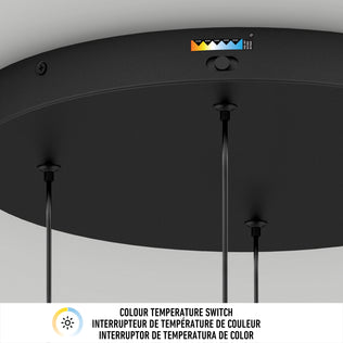 A close-up of the Artika Chorus 4 light LED pendant 5 CCT shows three hanging cords and a color temperature switch labeled from yellow to blue, displaying adjustment options. Below, text in three languages explains the color temperature switch.