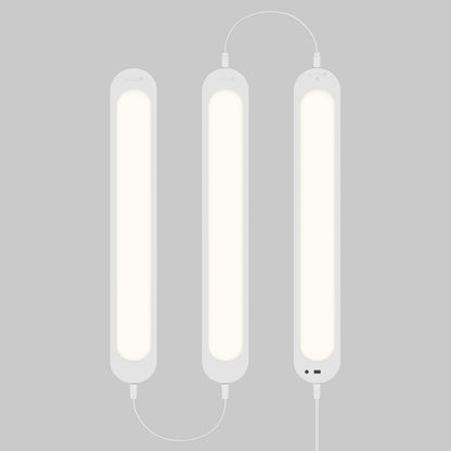 Artika Impulse Under-Cabinet LED Light RGB+CCT, three linked bars glow softly on gray, cables visible, includes remote.