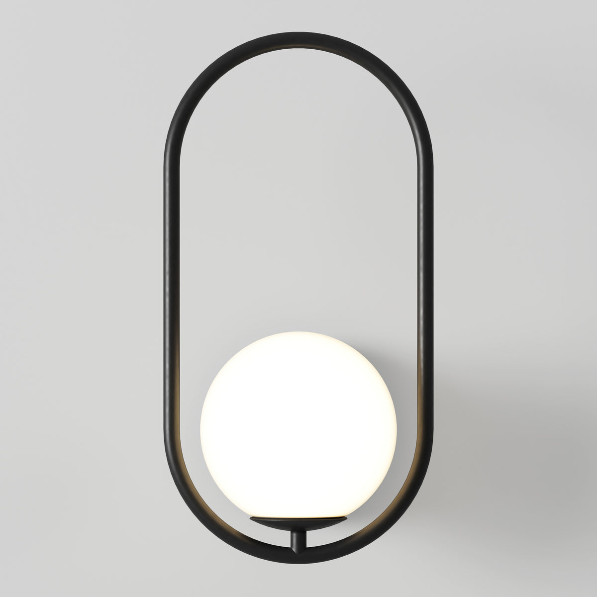 The Artika Bloom LED Sconce 3 CCT features a sleek black oval frame with a glowing white spherical bulb elegantly suspended at the center, creating a modern look against any light gray wall.