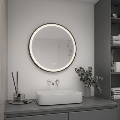 A modern bathroom with Artika’s Mateo 28 in. LED mirror, adjustable CCT, defogger, square sink, shelves, and vase with leafy branches.