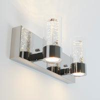 The Artika Ratio 2-light LED bathroom vanity light features a modern wall-mounted design with a rectangular chrome base and two bubble-detailed glass shades that emit bright, white light.