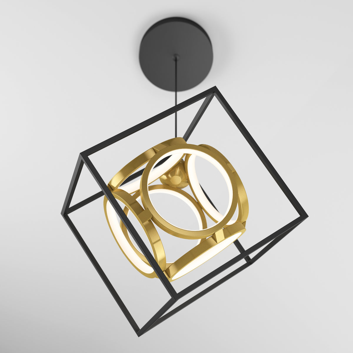 A modern ceiling light fixture featuring a black cube frame with gold geometric rings and circular LED lights suspended in the center, set against a white background.