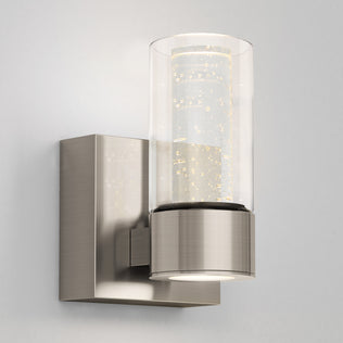 The Artika Essence 1-light LED vanity light features a bubble glass shade and brushed base, ideal for accenting a light gray wall.