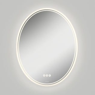 The Artika Corby 22 in. x 28 in. LED mirror features a glowing LED ring, three touch buttons for controls, and an integrated defogger, all mounted on a plain gray wall.