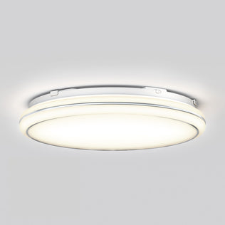 The Artika Emina 13 in. LED flush mount light 3 CCT features a modern, round white design, illuminating the room with a soft glow against a light gray ceiling.