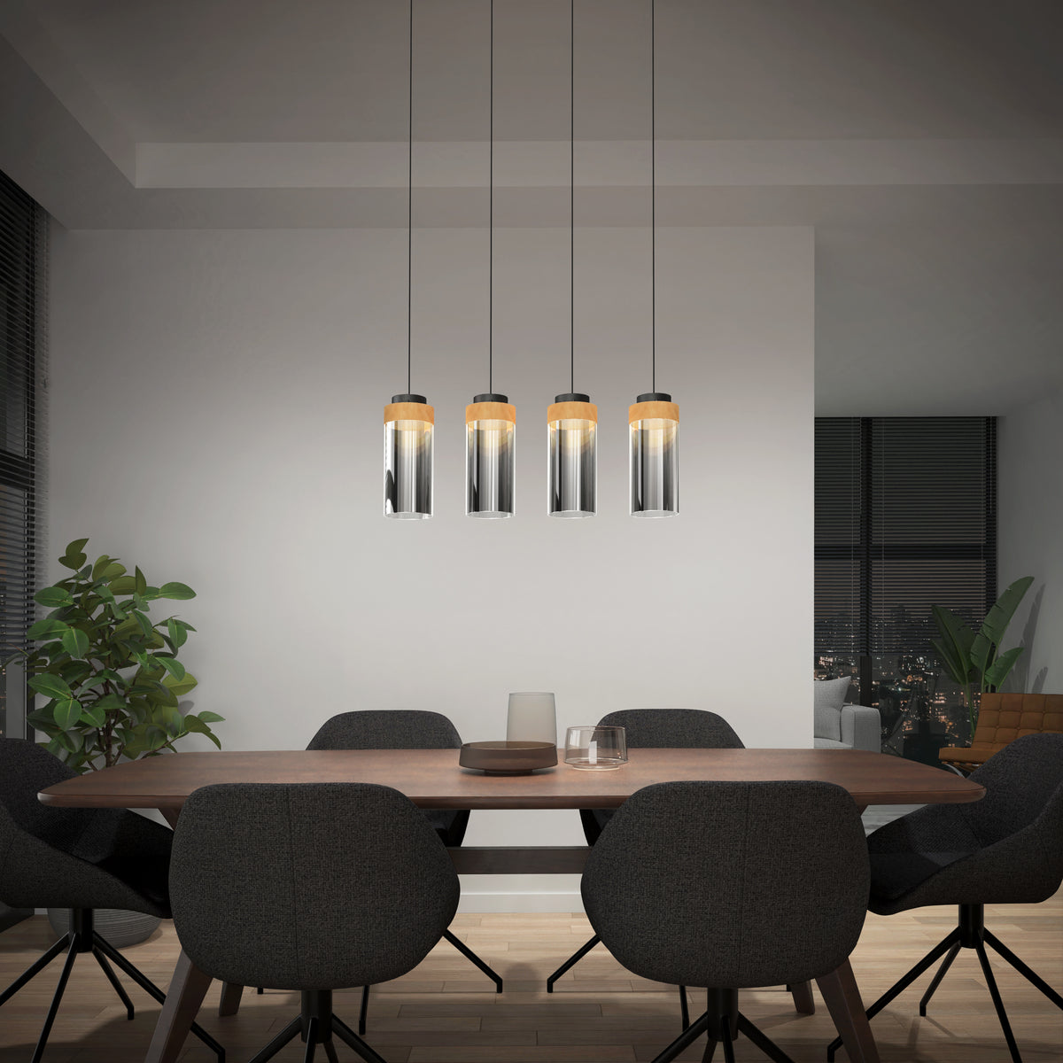 A modern dining room with a wooden table, six dark upholstered chairs, four pendant lights hanging above, a potted plant in the corner, and large windows with city views at night.
